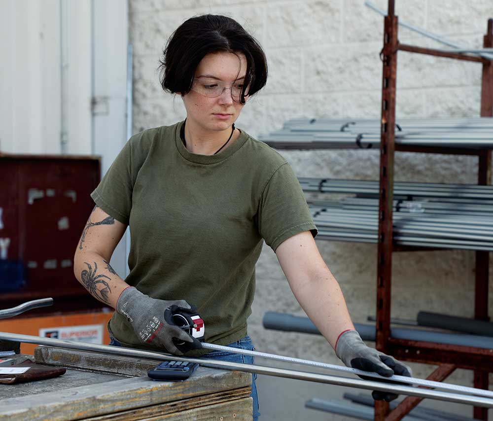 Student Lydia Davis works on a project at The Nashville Electrical Joint Apprenticeship and Training Committee (NEJATC) in Nashville, TN.