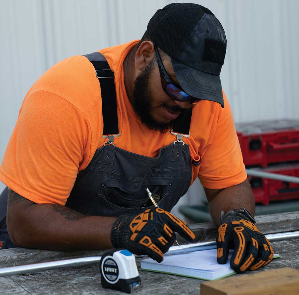 John Kuffel, instructor, and Lydia Davis, student, work on a project together at The Nashville Electrical Joint Apprenticeship and Training Committee (NEJATC) in Nashville, TN