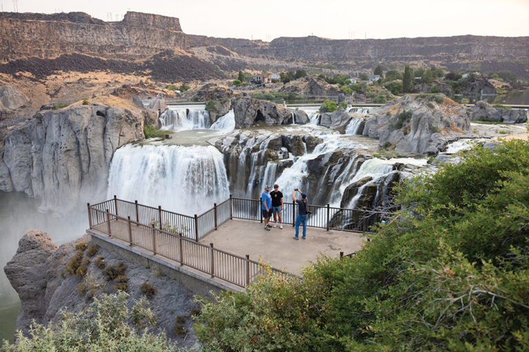 Visitors take photos at sunrise at Shoshone Falls in Twin Falls, Idaho. It's one of the top outdoor attractions in Southern Idaho.