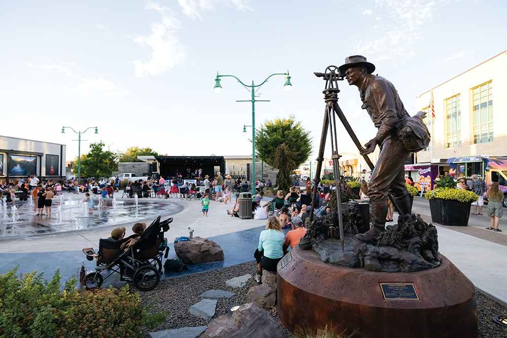 Visitors listen to music during the Twin Falls Tonight Summer Concert Series on the Downtown Commons in Twin Falls, Idaho.