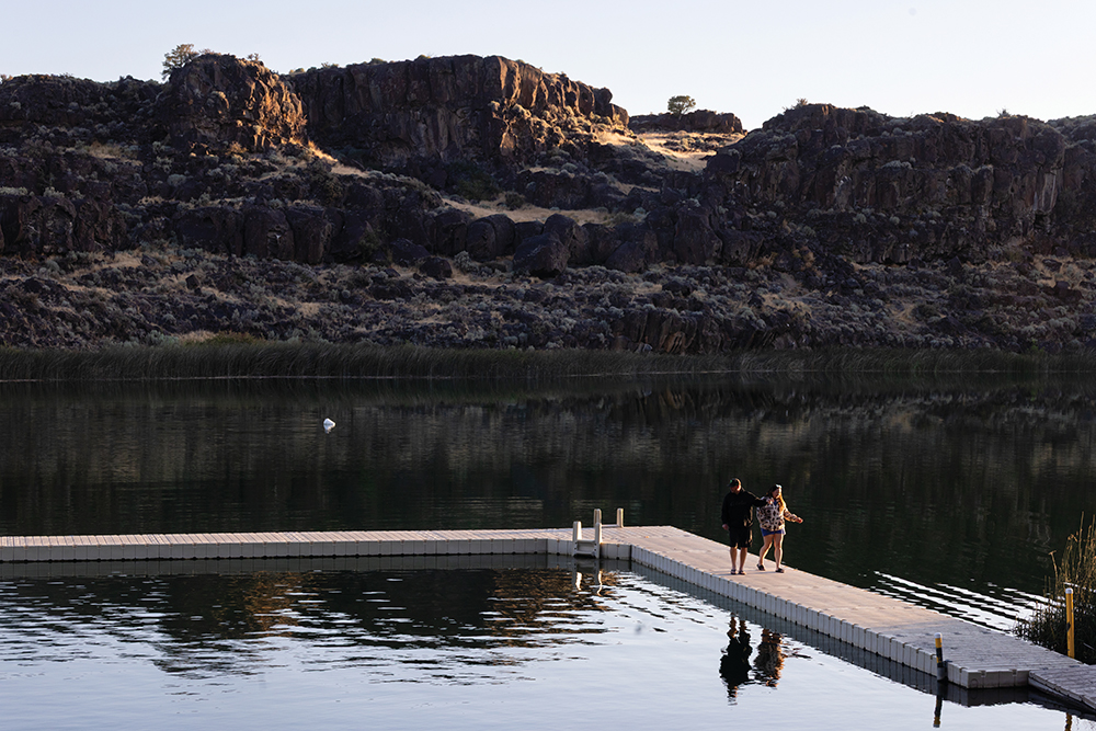 Visitors walk along the floating walkway at Dierkes Lake Park in Twin Falls, Idaho.