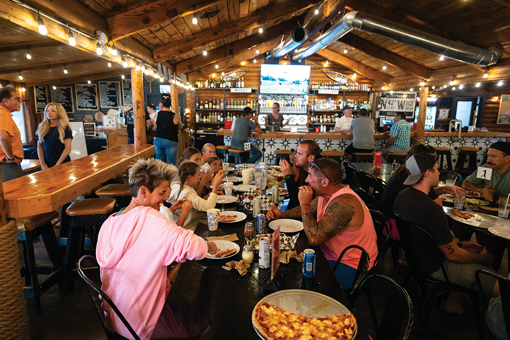 Visitors enjoy pizza at Portside Pizza and Pub at Riverside Resort and RV Park in Burley, Idaho.