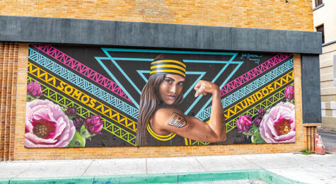 A colorful mural of a woman in downtown Albuquerque, NM. Albuquerque is one of 13 communities that celebrate New Mexico arts and culture.