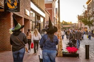 Salem, MA, US-October 21, 2024: People visiting the annual Haunted Happenings event held during the month of October in celebration of the town's history of witch trials and Halloween.