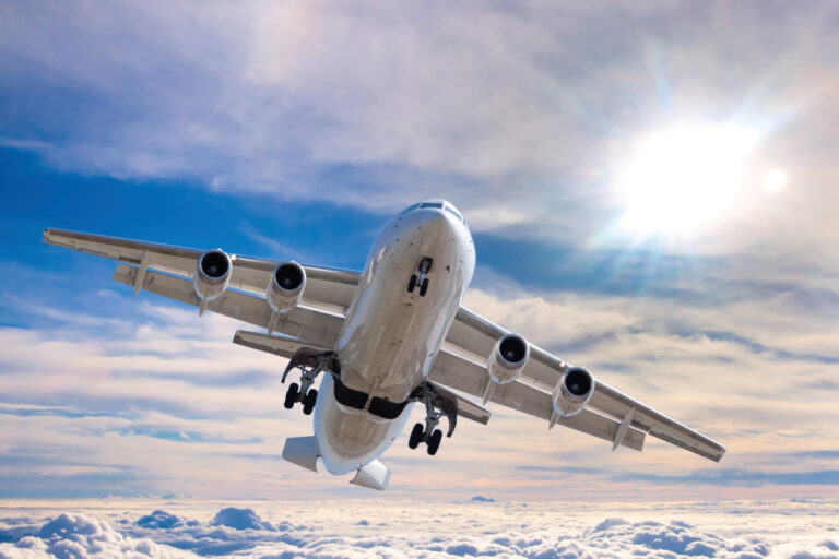 Aerial view of an airplane over a cloudscape.
