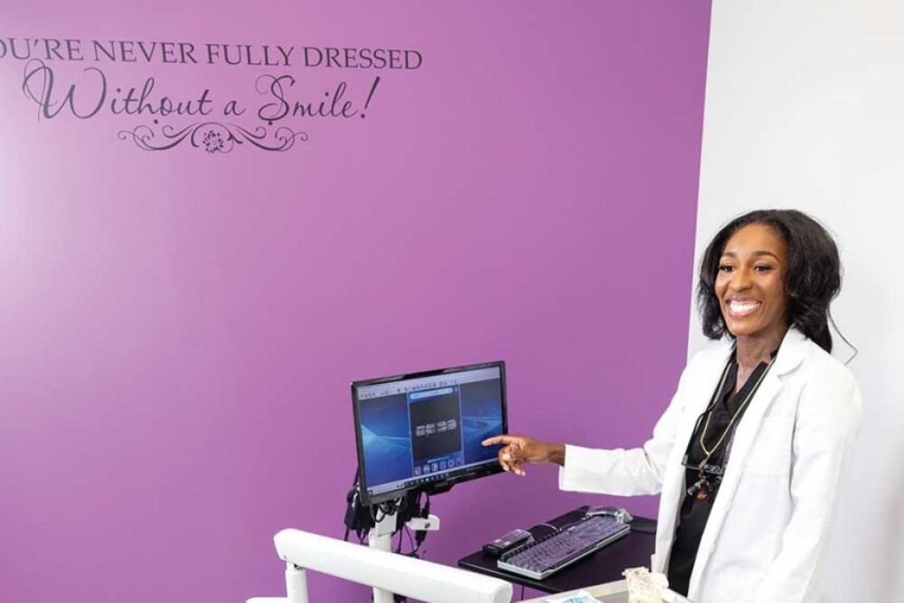 Dr. Tiffanie Garrison-Jeter, owner and dentist, consults with a patient at Definition Dental Studio in Nolensville, TN. 
