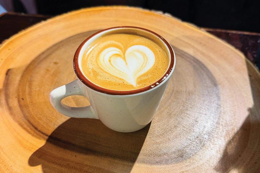 A latte with a milk foam heart on top at ByGood Coffee in Winston-Salem, NC.