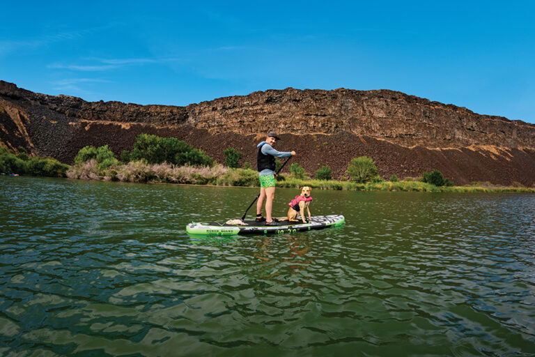 Paddle boarding with a dog on the Snake River in Buhl, Idaho.