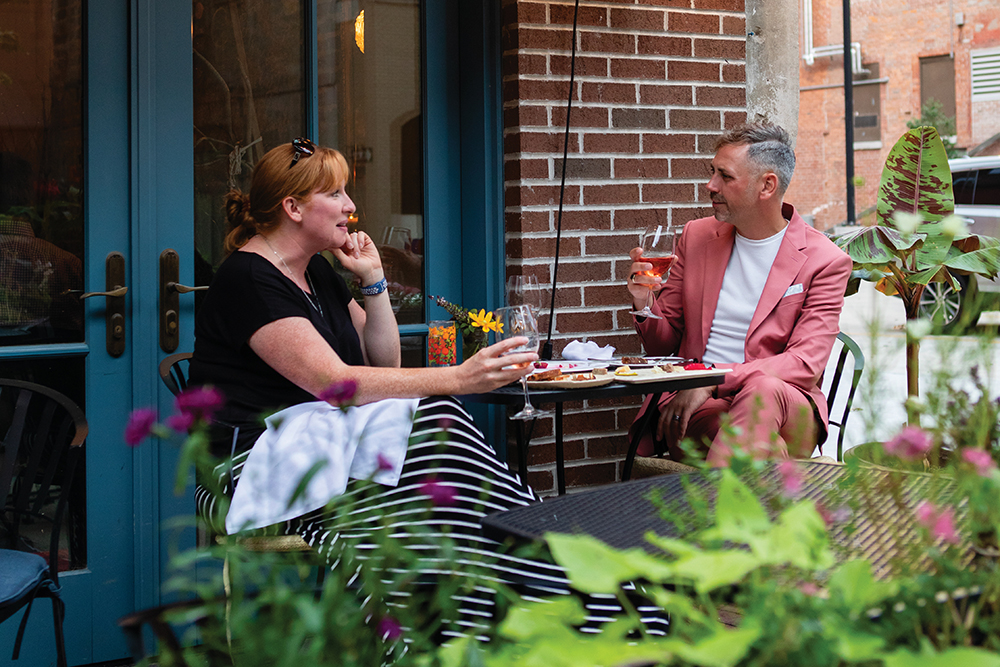 Jennie Telisak and Aaron Murphy eat on the patio of Cobble Hill in downtown Cedar Rapids, Iowa.