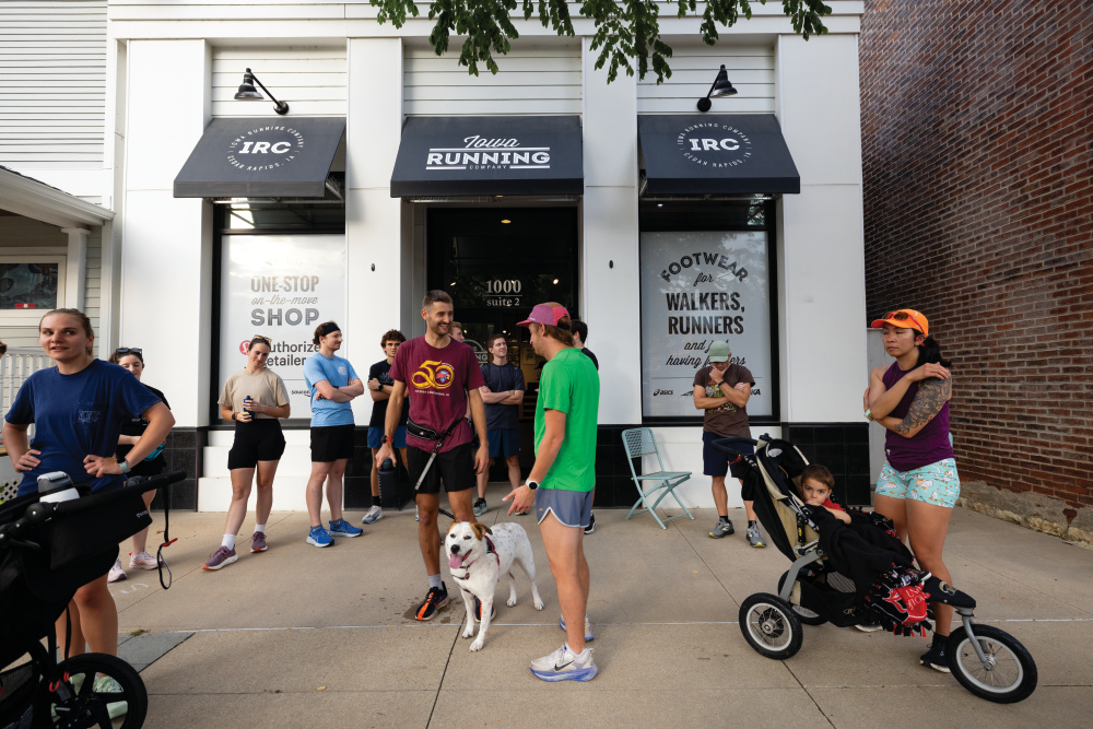 People gather for a weekly Thursday night run at Iowa Running Company in Cedar Rapids.