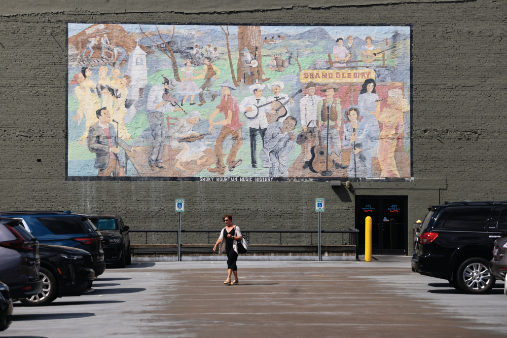 “Smoky Mountain Music History” Right: Muralist Raquel Roy