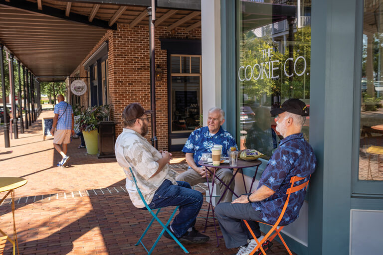 Henry Frickel, left to right, Dennis Hartman and John Stephens enjoy the morning in front of Cookie Co. at Old Town Columbus GA.