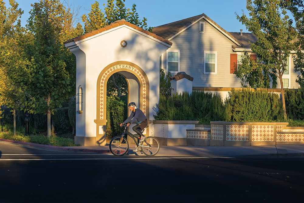 Residents cycle through the Bethany Village neighborhood of Mountain House, CA.