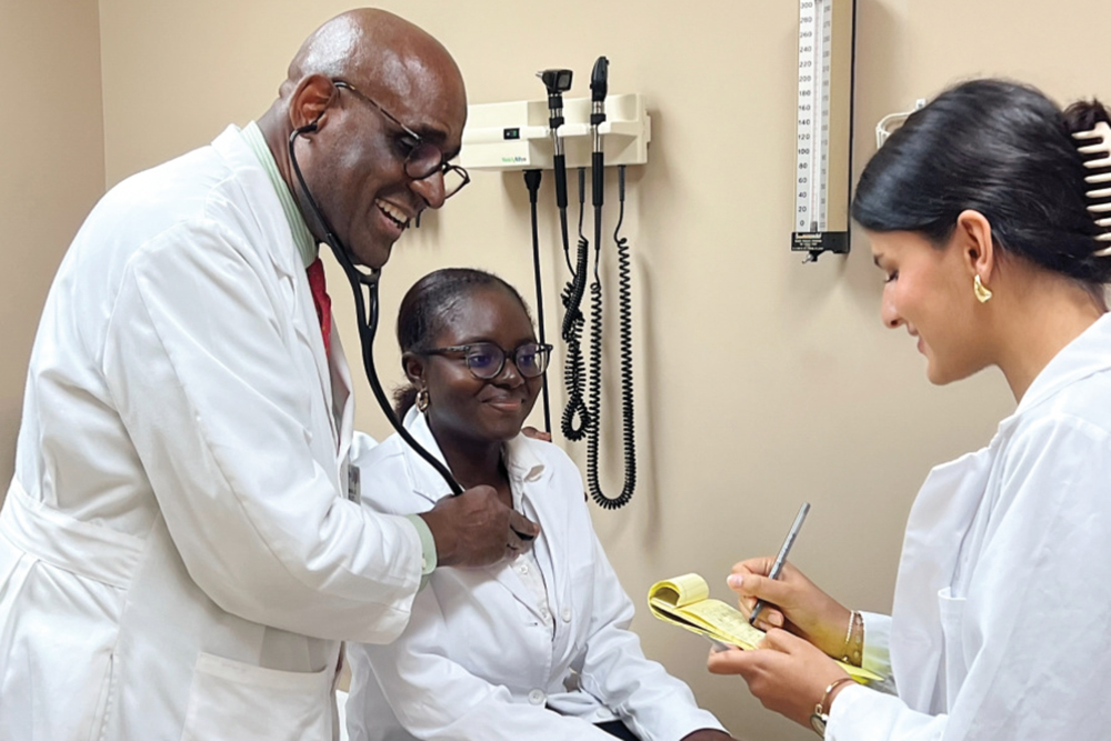 Fiza Khan (senior biology major) working at Dr. Folarin A. Olubowale’s Columbus office as a scribe. Pictured is Fiza with Dr. Olubowale and another Competitive Pre-Medical Studies student, Blessing Dike (Junior), acting as the patient.  Blessing is also working for him as a scribe.