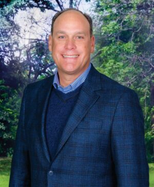 Headshot of Kurt Kane, president & CEO of TruGreen. TruGreen is a lawn care company that provides services such as fertilization, weed control, and insect management for residential lawns and also offers tree and shrub care.
