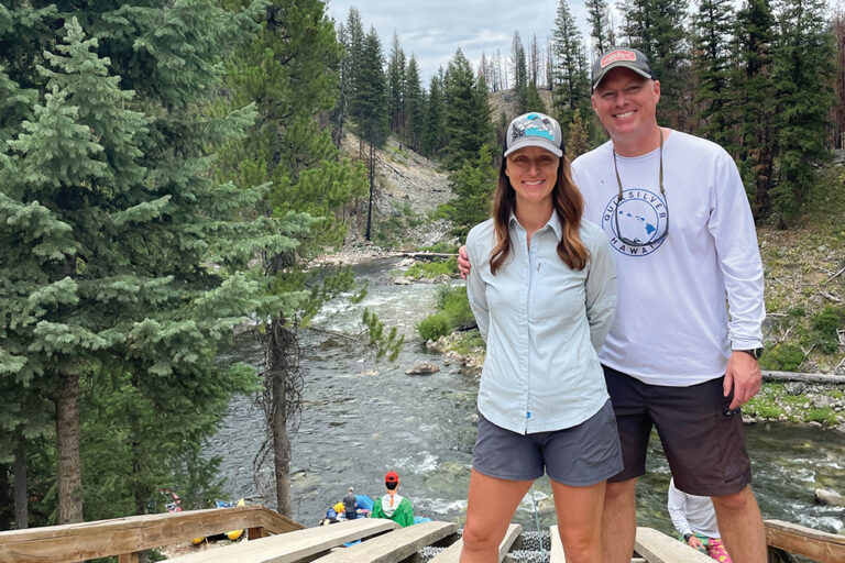 Mandi Thompson and her husband, of Twin Falls, Idaho, pose for a photo in front of the Snake River.