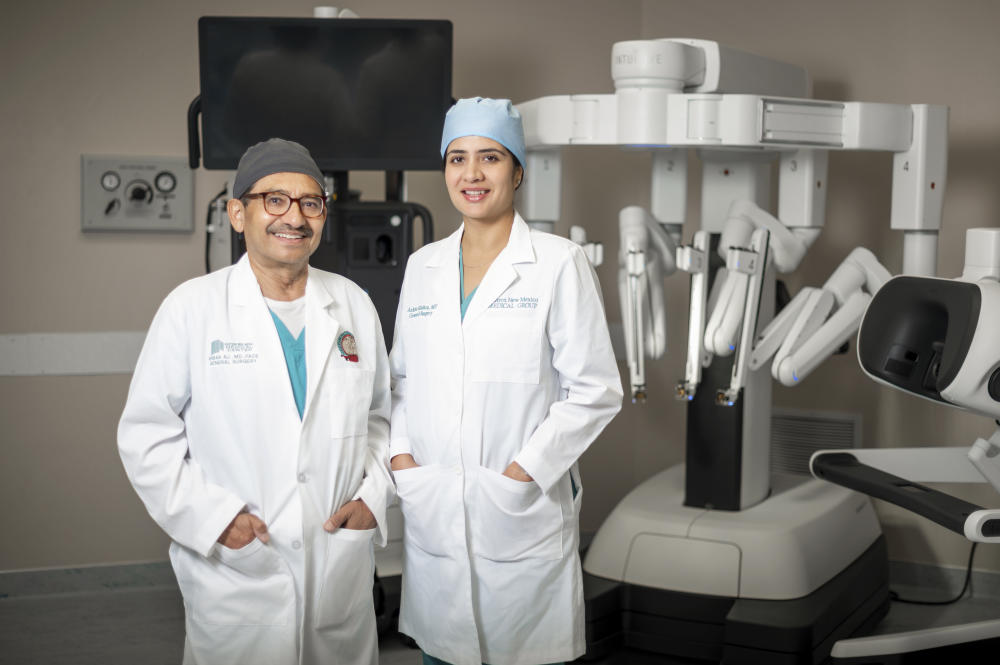 Dr. Akbar Ali and Dr. Mishra (robot assisted surgery)