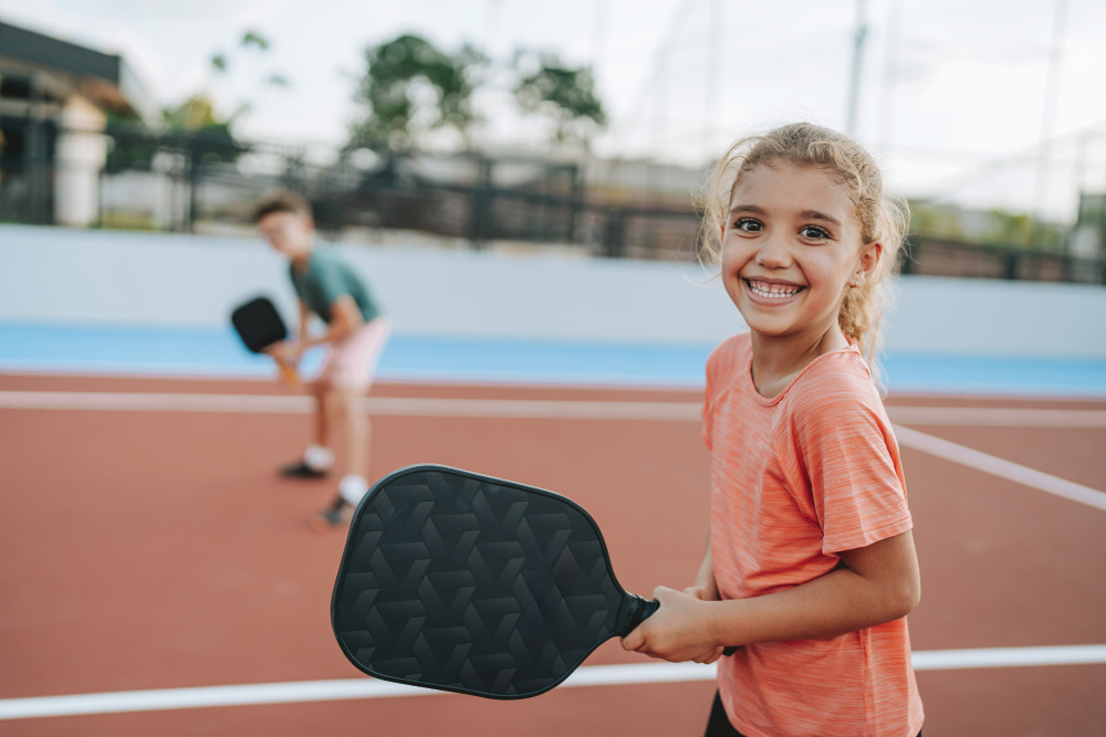 girl playing pickleball