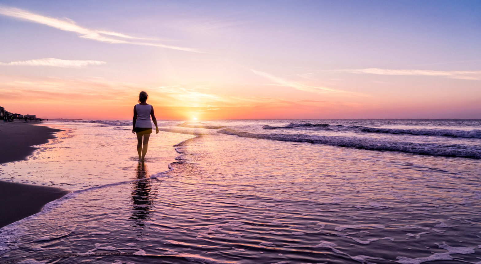 Woman walking on the beach in Myrtle Beach, SC