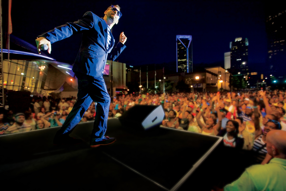 Artist Jon B performs for the crowd on the Coca-Cola Stage at the Food Lion Speed Street Sponsored by Coca-Cola in downtown Charlotte, North Carolina.