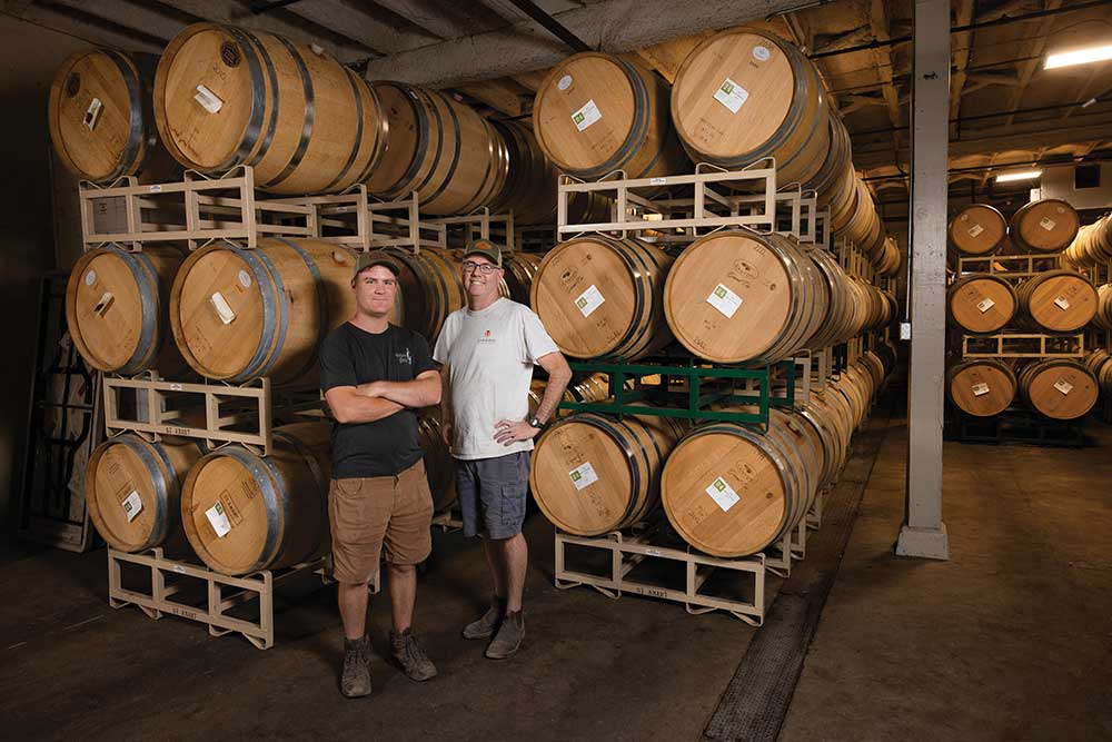 Winemaker Stuart Spencer, right, and General Manager Nathan Haberkern, left, with wine barrels in the cellar at St. Amant Winery in Lodi, California.