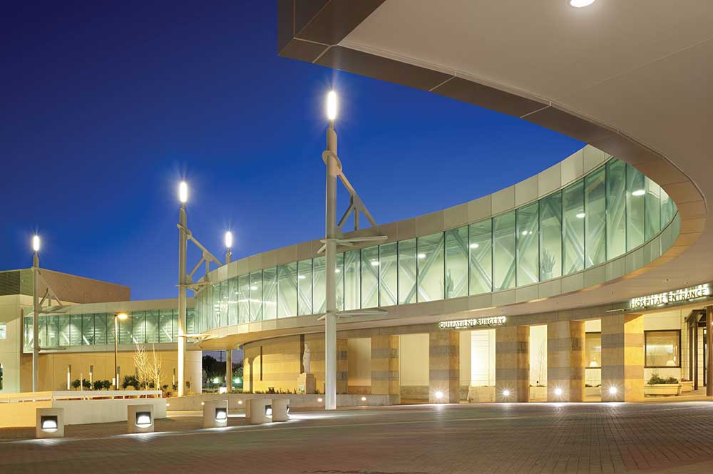 Exterior shot of St. Joseph’s Medical Center in San Joaquin County, CA, at dusk.