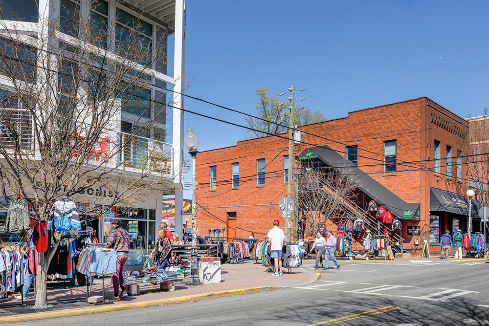Sidewalk vendors display their wares in front of Protagonist Taproom in North Davidson (NoDa) on a warm, sunny winter day in Charlotte, NC.