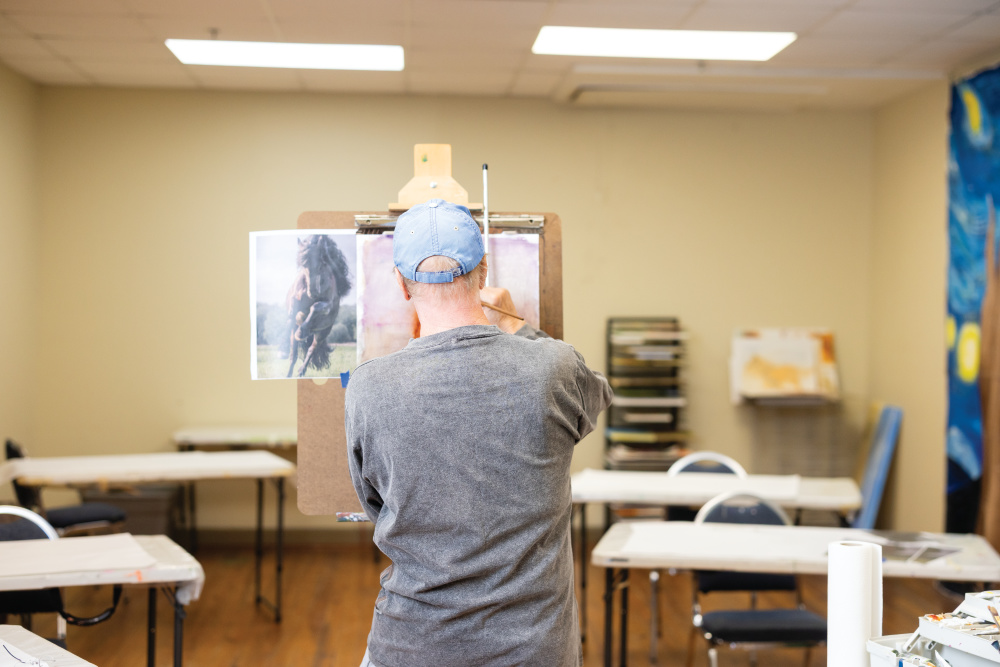 Man painting at Aiken Center for the Arts in Aiken, SC