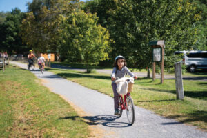Bikers ride along the Virginia Creeper trail in Damascus VA. It's one of many outdoor destinations in Washington County to explore.