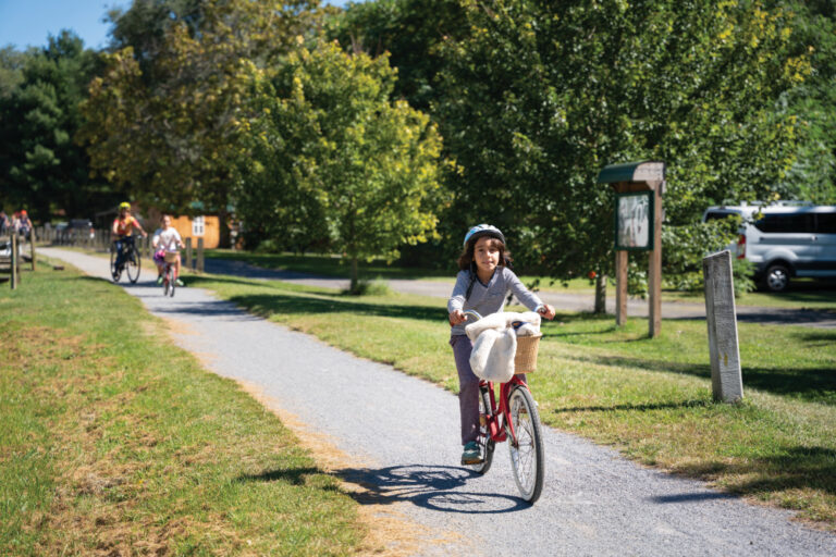 Bikers ride along the Virginia Creeper trail in Damascus VA. It's one of many outdoor destinations in Washington County to explore.