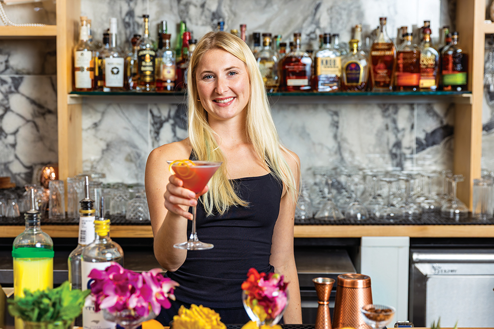 Chief Mixologist Kelly Toppin mixes up a Crush Cosmo behind the bar at Crush Vodka Distillery & Cocktail Bar in Greenville, NC.