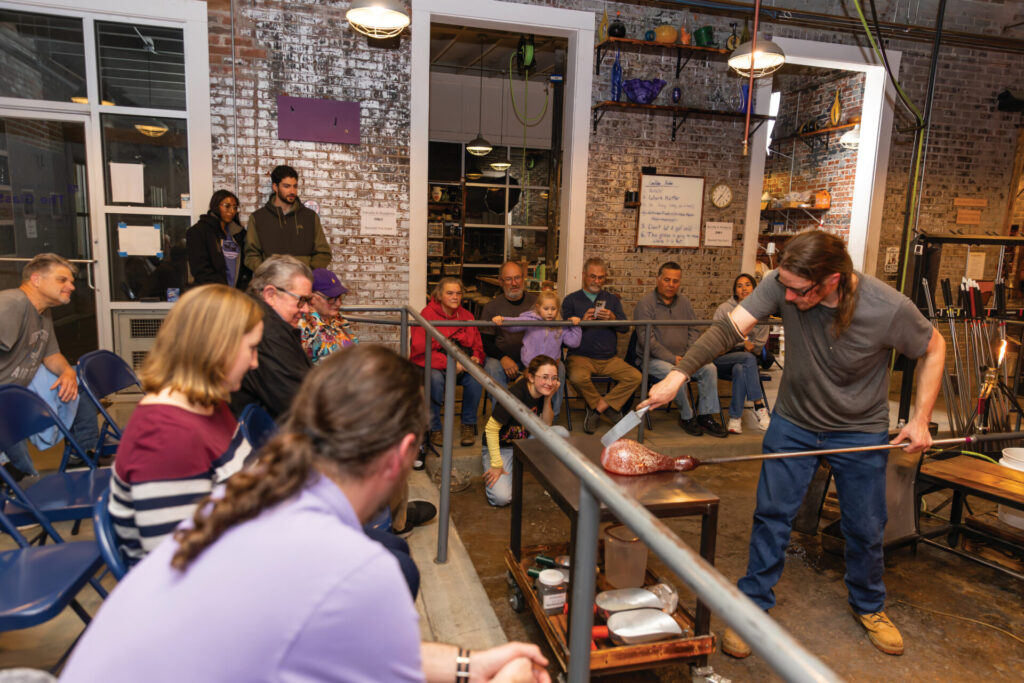 Mike Tracy makes a glass turkey during a demo for a public audience at ECU GlasStation in Farmville, NC.