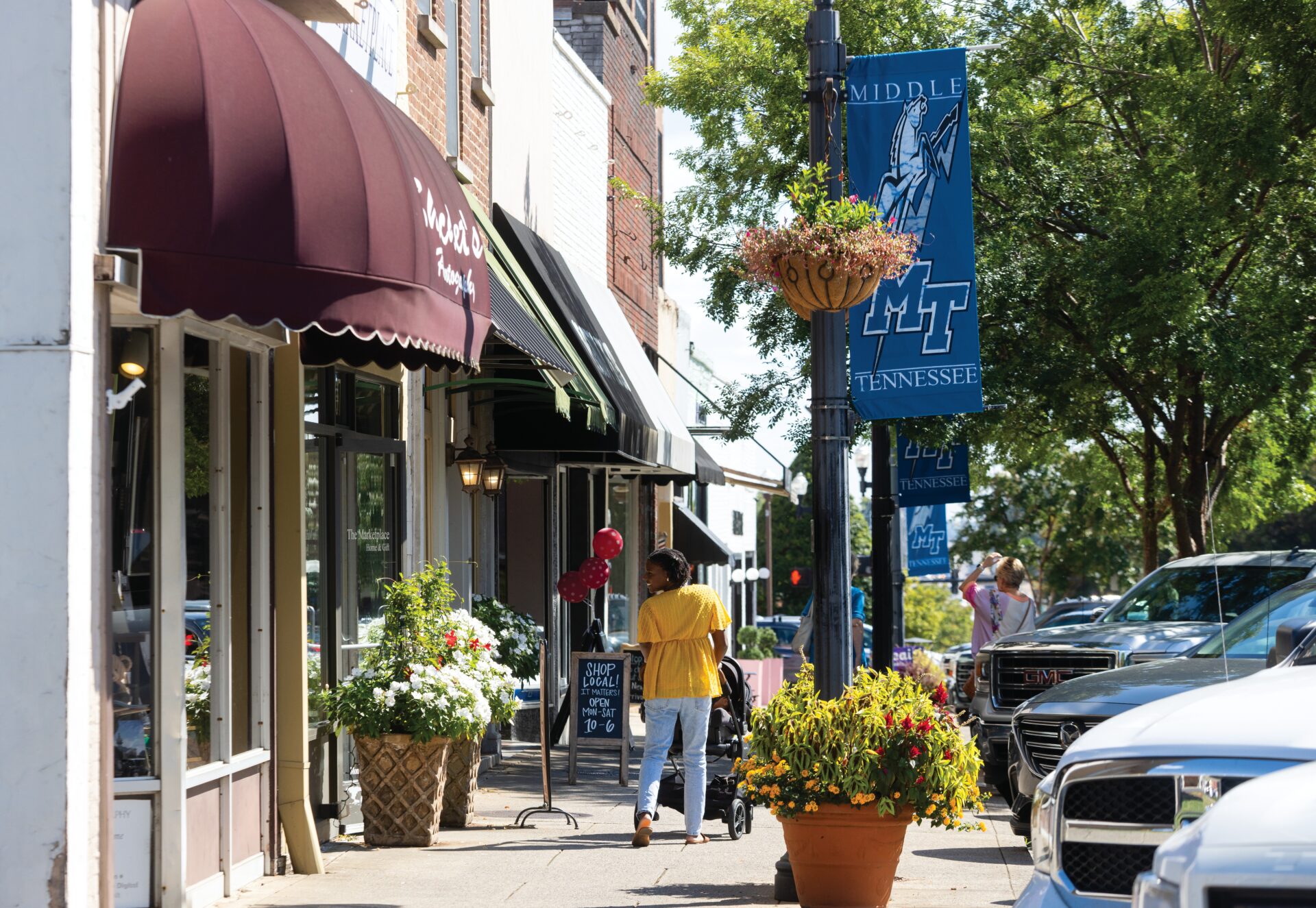 Visitors walk past businesses on the Public Square in downtown Murfreesboro, Tennessee.