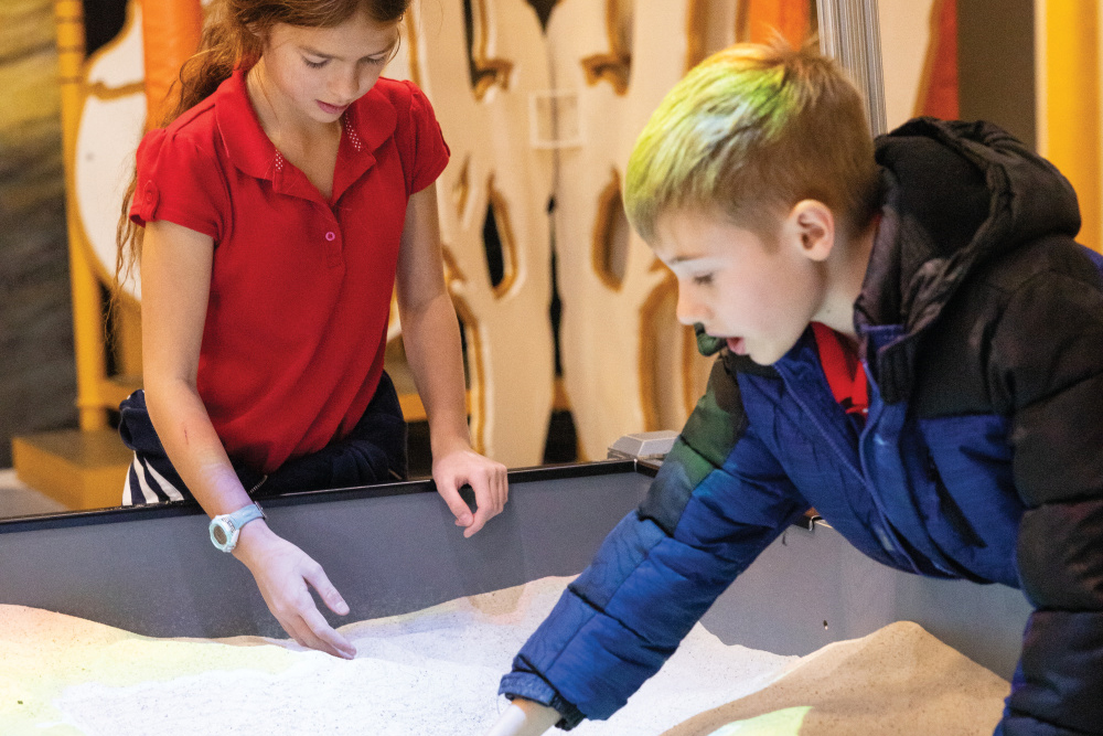 Middle school-age children play at Hands On! Discovery Center and Gray Fossil Site
