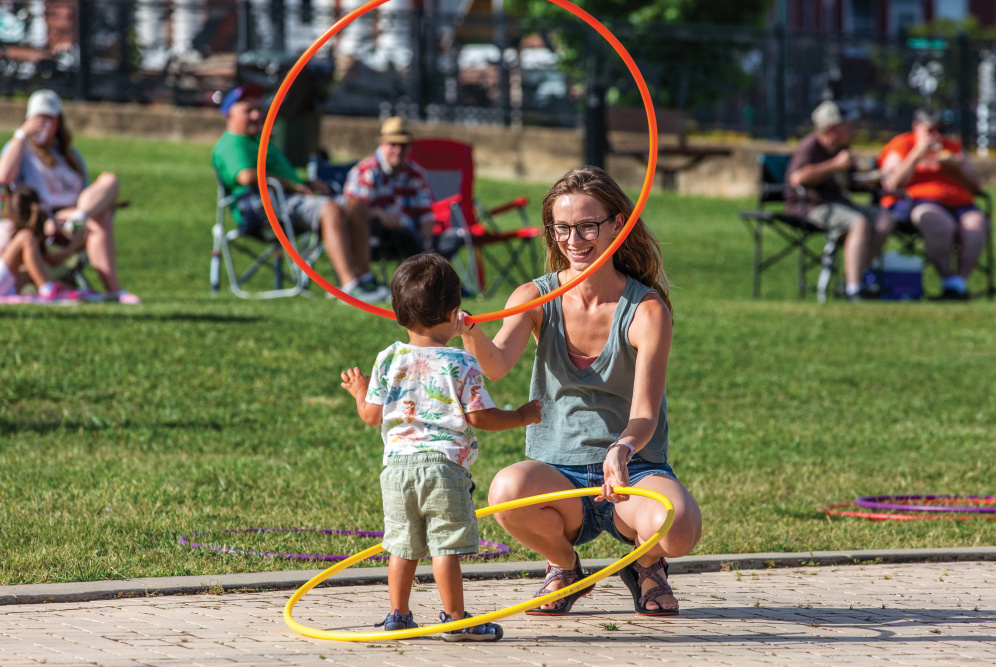 A mother and her young son play with hula hoops at Fridays After 5, one of many family-friendly things to do in Johnson City, TN.