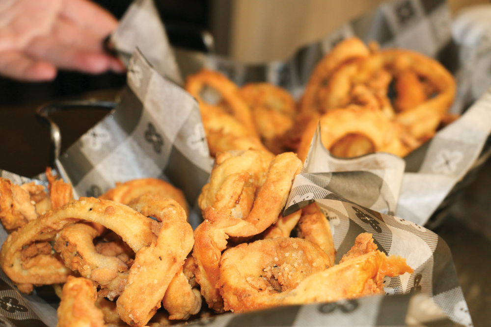 The Cellar’s hand-sliced signature onion rings. The Cellar is among the best restaurants in Kearney, NE.