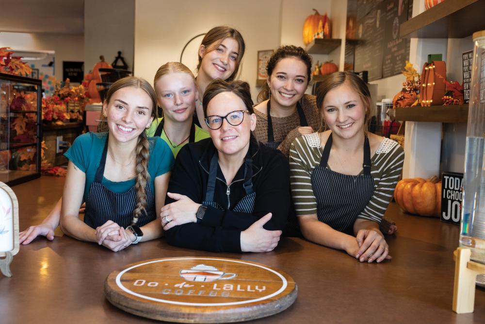 Sarah Haymon, middle, owner of Oo De Lally Coffee surrounded by her employees in Castle Rock, Colorado.