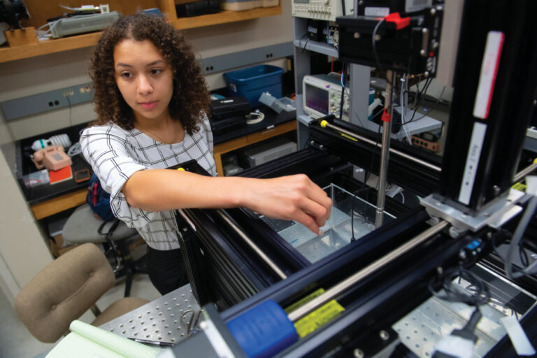 Claudia K.M. Chambliss, an award-winning biochemistry and physics undergraduate student, conducting research in the lab at the National Center for Physical Acoustics.