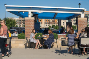 Employees eat lunch on the patio at WellSky with views of downtown Overland Park, KS.