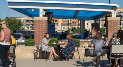 Employees eat lunch on the patio at WellSky with views of downtown Overland Park, KS.