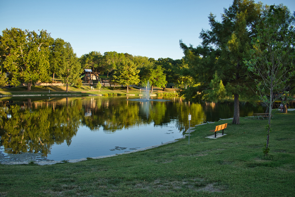 Fountain Spraying into Reflective Waters at Sar Ko Par Park in Lenexa Kansas