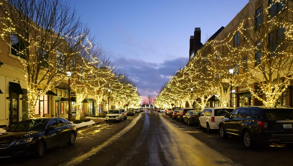 Strings of lights in trees on a city street in Leawood, KS