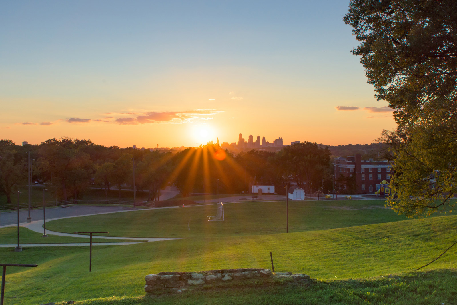 A local park with soccer goals with the Kansas City, MO skyline in the background