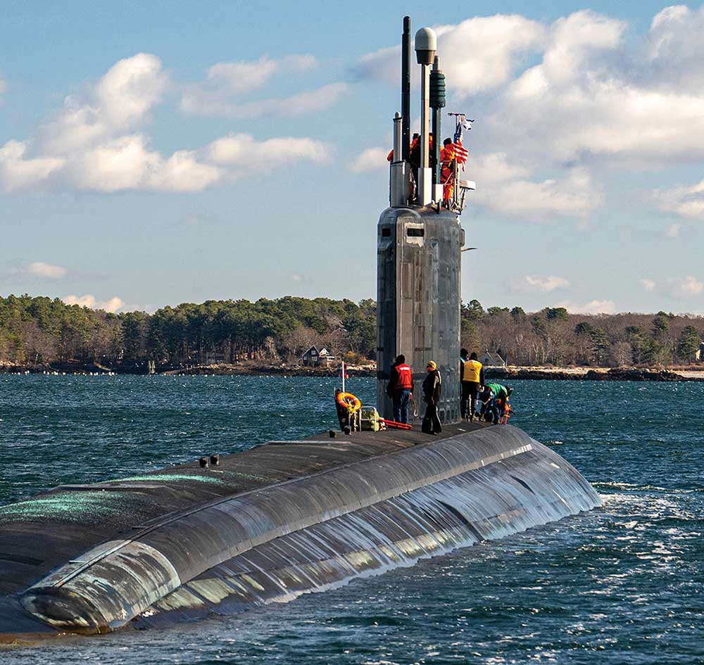 Works aboard a ship at Portsmouth Naval Shipyard.