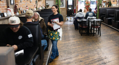 Servers wait on customers during lunch at Ky's American Bistro in downtown New Castle, Indiana.