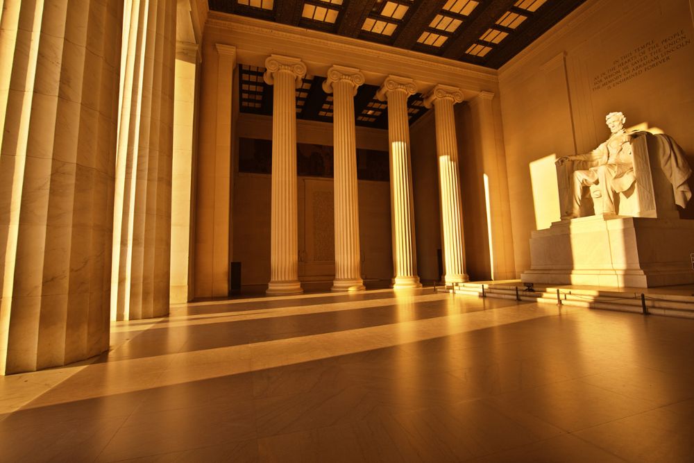 The Lincoln Memorial architecture with the Abraham Lincoln statue inside at sunrise in Washington DC.