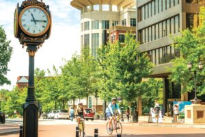 People riding bikes through downtown Greenville SC