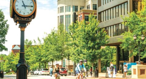 People riding bikes through downtown Greenville SC