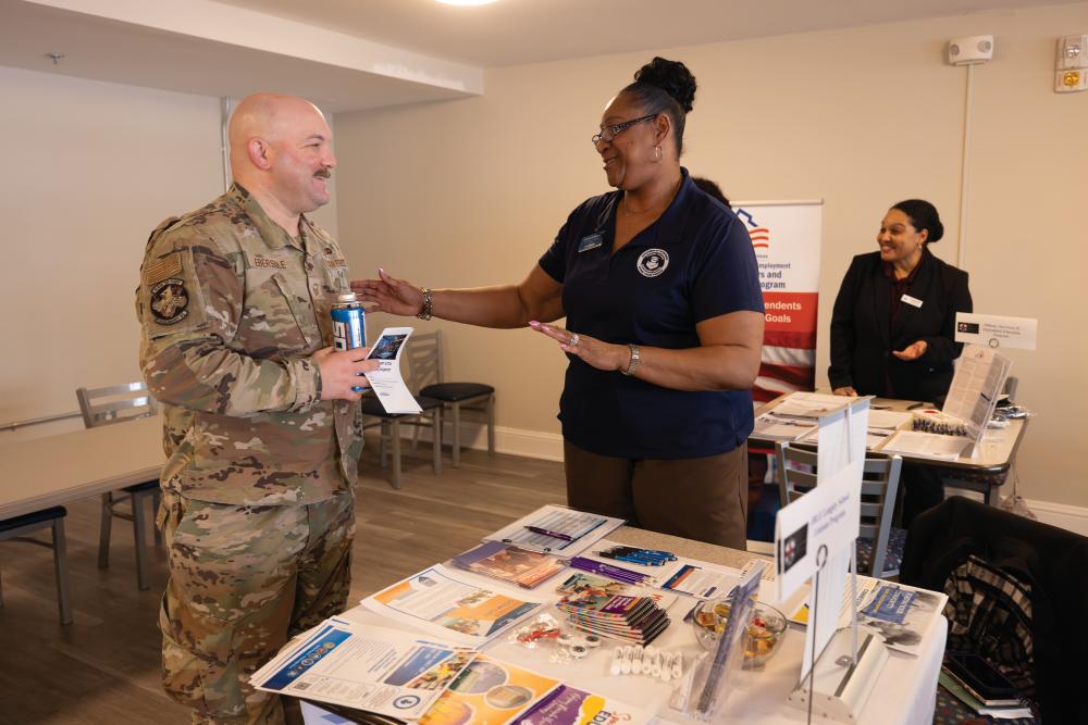 Terrilyn Williams, right, helps David Ebersole with how to transition from the Air Force during forum hosted by the Hampton Roads Veterans Employment Center at Langley Air Force Base in Hampton.