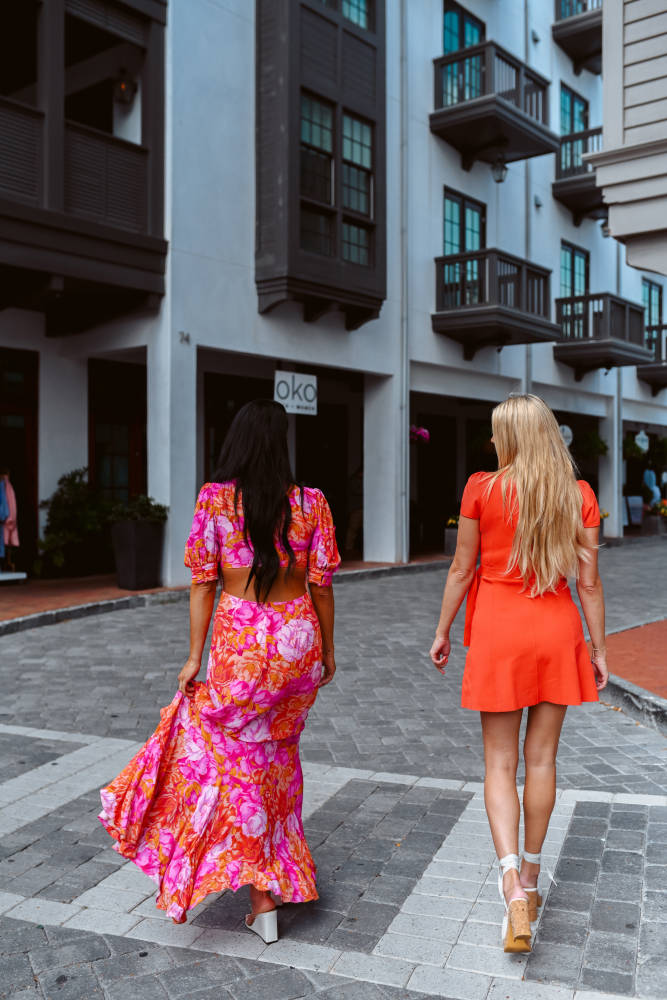 Amy Moore and Kasen Hicks in Rosemary Beach walking with shopping bags